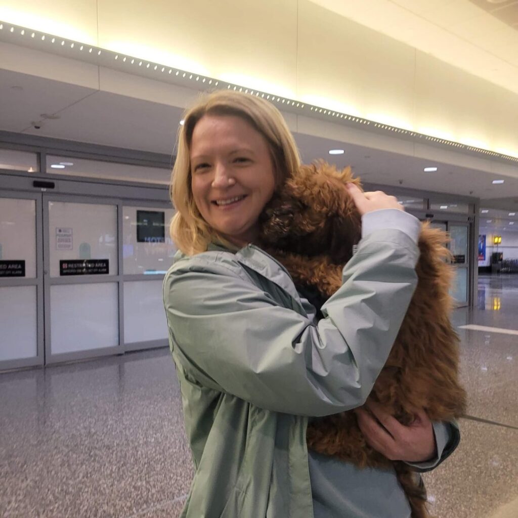 Whoodle puppy at the Airport
